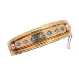A late Victorian sapphire and diamond hinged bangle,