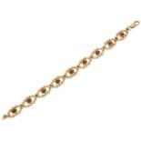 A 9ct gold garnet and emerald bracelet,