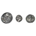 Three ancient coins.