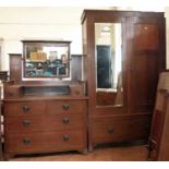 Late 19th century Arts & Crafts design oak two piece bedroom suite to include a mirror-door wardrobe