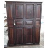 Edwardian oak panelled storage cupboard, 141cm wide, 187cm high, 54cm deep.