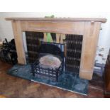 Art Deco tiled fire inset with oak surround complete with cast iron basket on granite base