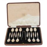 A cased set of George VI silver teaspoons and sugar nips,