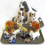 A pair of marble bookends decorated with cast metal cocker spaniels, Beswick Jack Russell Terrier, T
