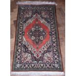 Iranian Qum silk rug, pink ground central medallion, cobalt blue spandrels, single repeating