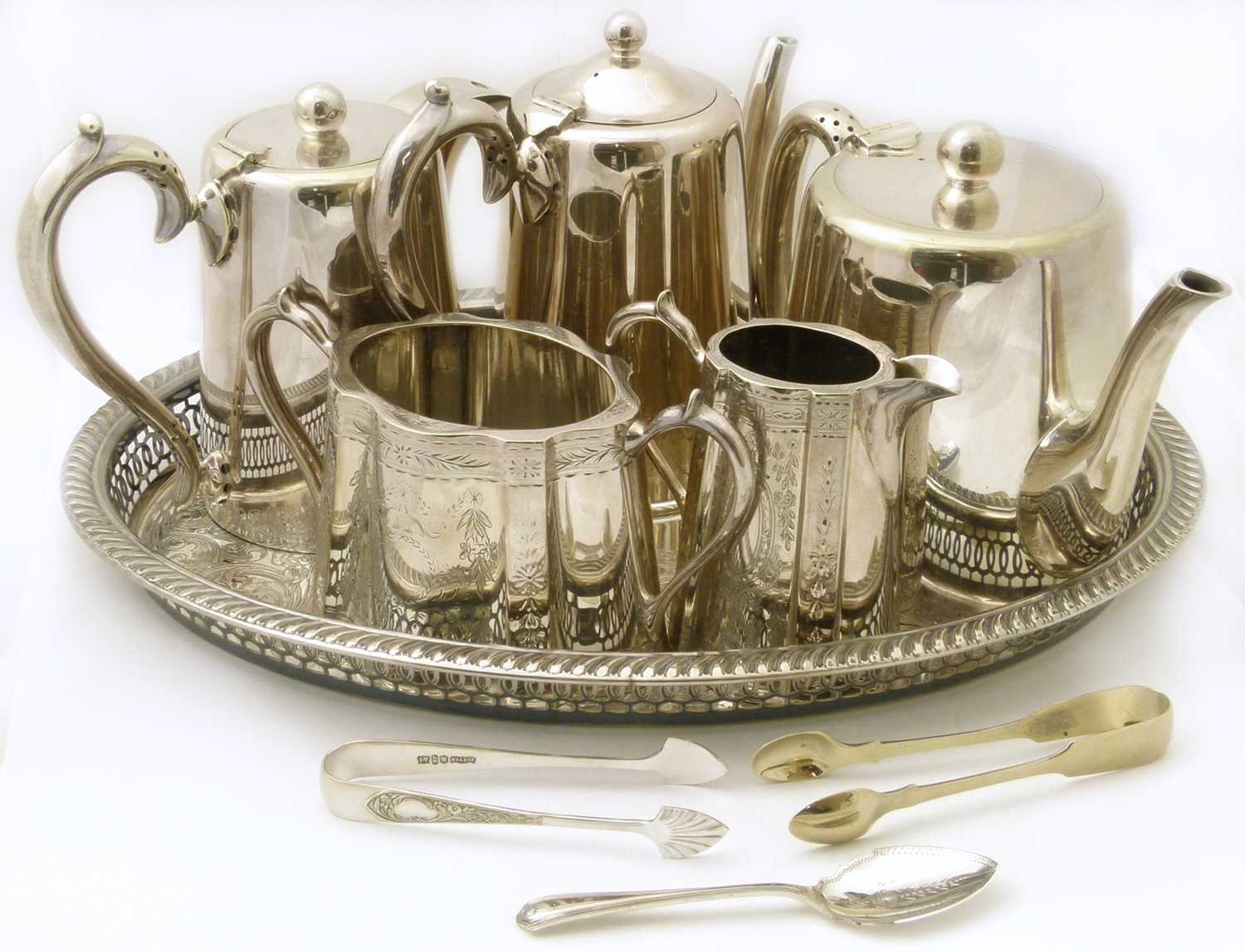 A collection of plated silverware