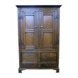 Early 18th century oak panelled standing cupboard