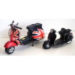 Two model metal-ware and resin models of scooters.