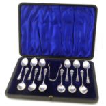 A cased set of Victorian silver spoons and sugar nips,