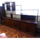 Early 20th century beech three door cabinet 279cm wide with tiered open shelving on top