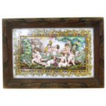Capodimonte plaque in carved wood frame..