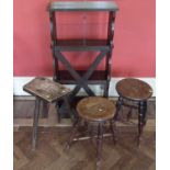Two Victorian elm stools with four legs, earlier three leg stool and open oak bookcase.