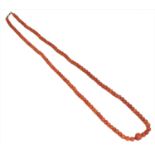 A coral bead necklace,