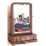 Early 19th century walnut swing frame toilet mirror complete with three drawers