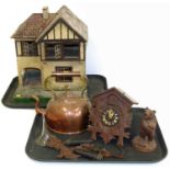 Early 20th century dolls house, copper kettle, cuckoo clock and a small black forest style bear hold
