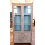 Victorian two door glazed cabinet with cupboard to base