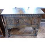 Jacobean style oak side-cupboard on turned front legs