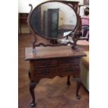 George III walnut and crossbanded low boy on cabriole legs and swing framed toilet mirror