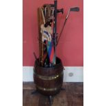 Oak barrel stick stand with centre column guide and quantity of sticks and two yard sticks etc.