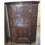 Early 20th century carved oak wardrobe.