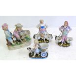 A pair of continental Boehme porcelain bon bon figures, another similar cherub and a figure group 21