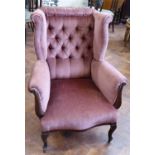 Edwardian wing back deep buttoned arm chair with mahogany frame