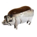 An Edwardian novelty silver pig pin cushion