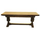 A well made reproduction dining table possibly by Titmarsh & Goodwin