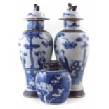 Chinese ginger jar with pierced wood lid, also a pair of lidded vases with crackle glaze.