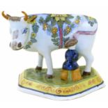 Delft cow and milkmaid group, the base marked O.U.D. Delft, late 19th century