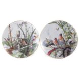 Pair of Montereau chargers painted with bird studies.