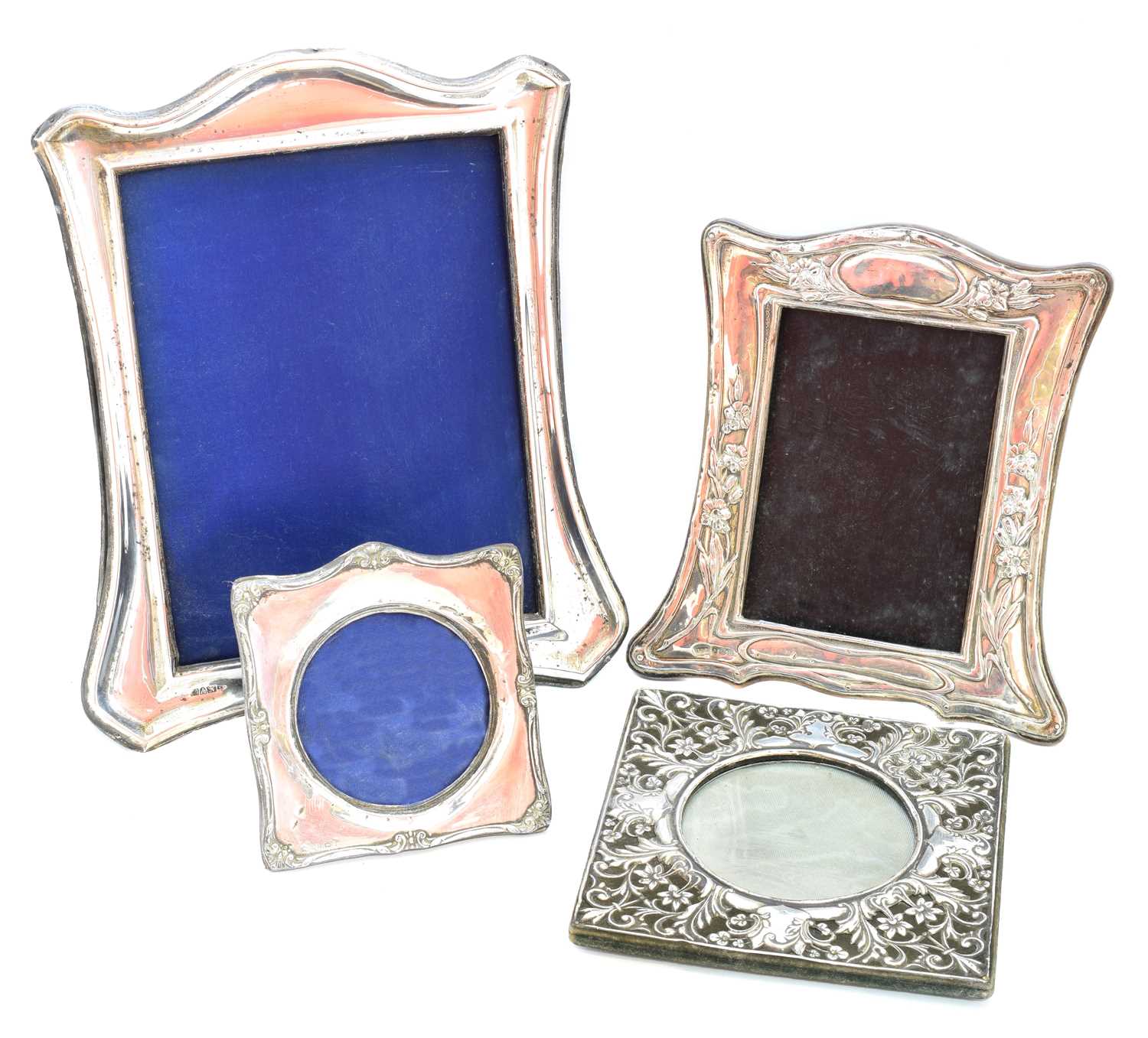 Four early 20th century silver fronted picture frames