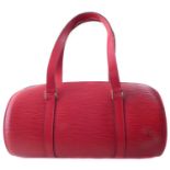 A Louis Vuitton red Epi Soufflot handbag and pouch,