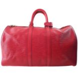 A Louis Vuitton red Epi Keepall 45 luggage bag,