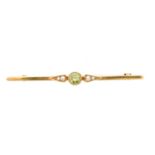 An early 20th century peridot and split pearl brooch by Murrle Bennett & Co.,