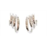 A pair of 18ct gold diamond earrings,