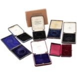A selection of pocket watch boxes, pouches and fitted cases,
