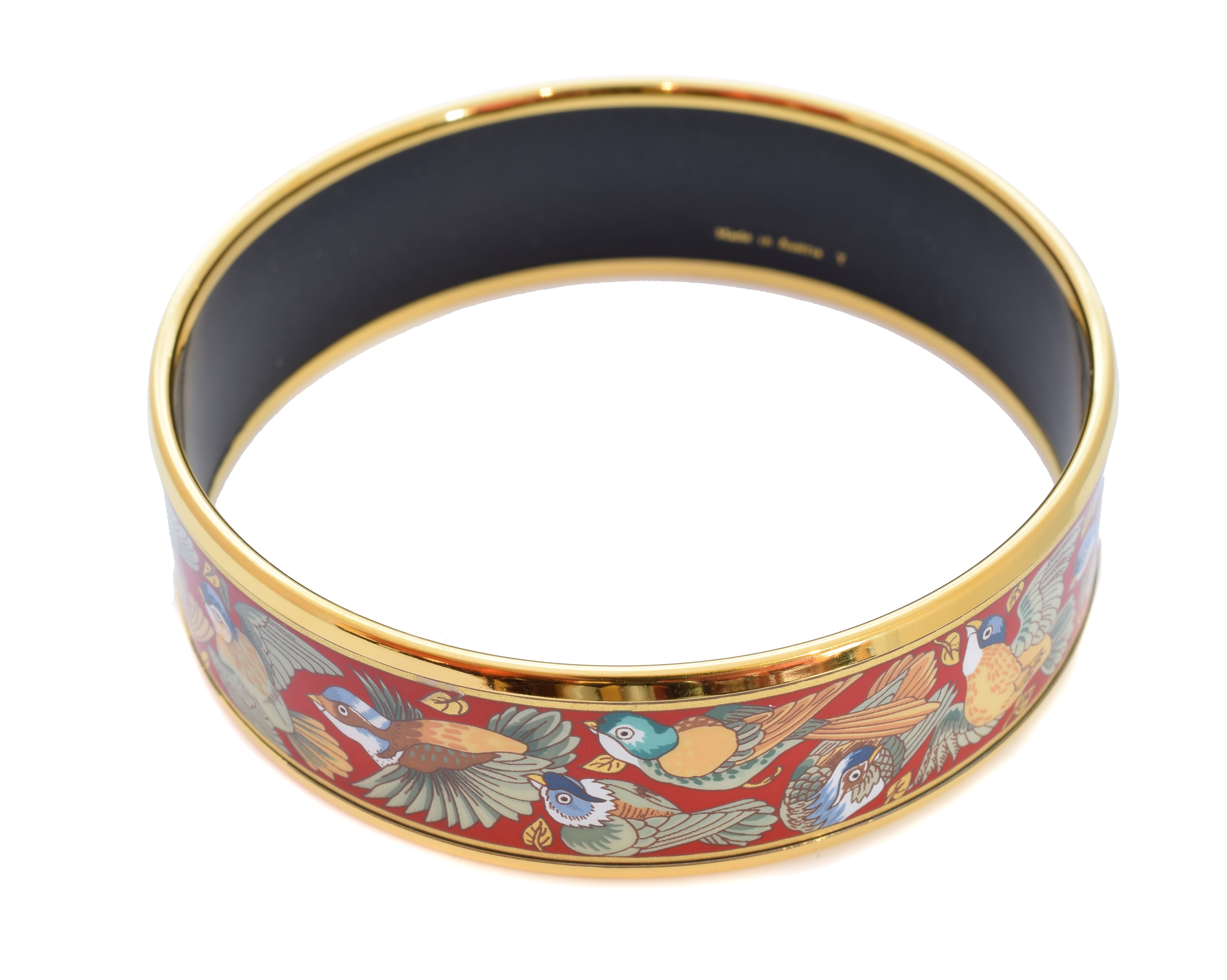 A Hermès 'Birds Species' gold-tone enamel bangle bracelet,