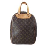 A Louis Vuitton Excursion handbag,
