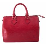 A Louis Vuitton red Epi Speedy 25 handbag,