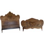 Early 20th-century walnut veneered bed ends.