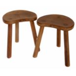 Two Robert "Mouseman" Thompson oak kidney shaped cow stools.