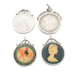 Four silver coin pendants,
