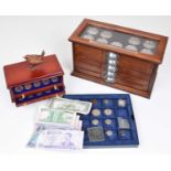 Three Danbury Mint presentation sets and small assortment of coins and banknotes.