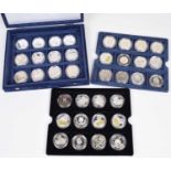 Cased set of 36 silver proof coins to include many commemorative sized crowns, fifty pences etc.