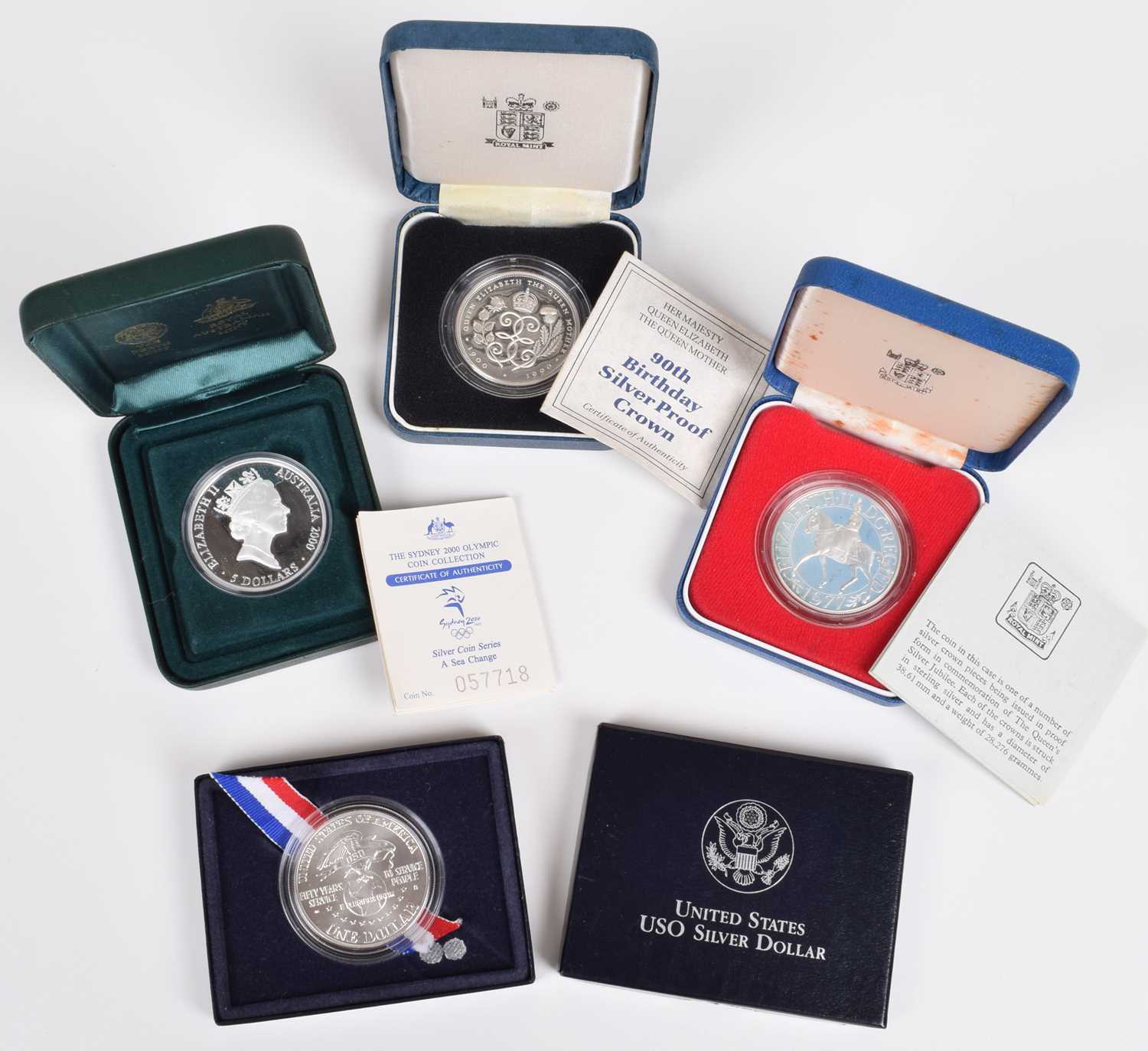 An assortment of historical/ world coinage to include cased Royal Mint Silver Proof Crowns.