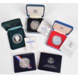 An assortment of historical/ world coinage to include cased Royal Mint Silver Proof Crowns.