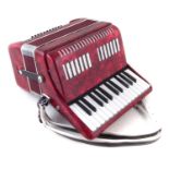 Unnamed piano accordion in case.