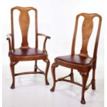 A set of six Queen Anne style light oak dining chairs
