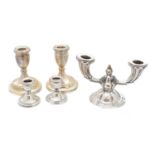 A selection of silver candlesticks,